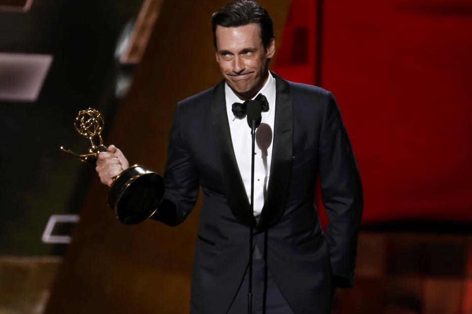 Jon Hamm accepts the award for Outstanding Lead Actor In A Drama Series for AMC's "Mad Men" at the 67th Primetime Emmy Awards in Los Angeles