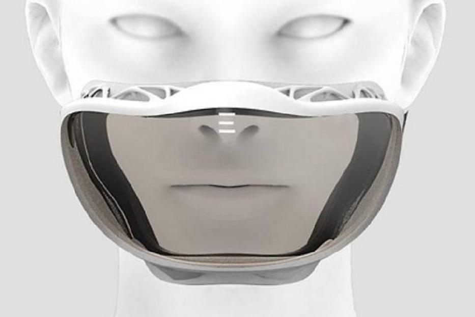 Eine futuristisch anmutende, verspiegelte Gesichtsmaske auf einem weißen Dummykopf.