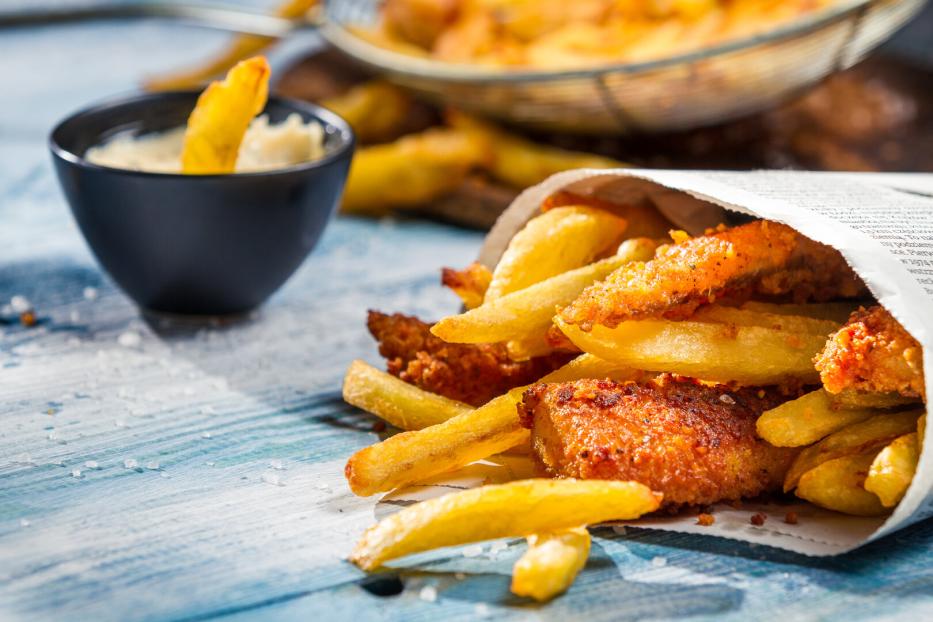 Closeup of Fish & Chips served in the newspaper
