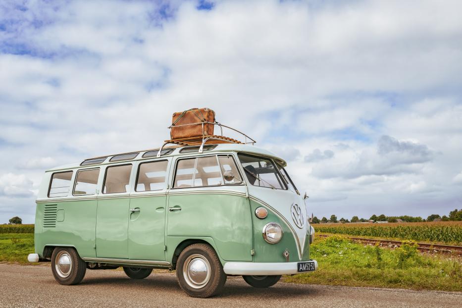 Volkswagen Bus Type 2 T1 camper van driving through the countryside