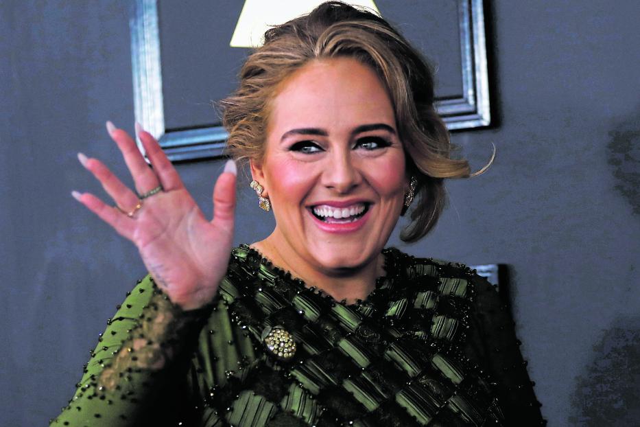 FILE PHOTO: Singer Adele arrives at the 59th Annual Grammy Awards in Los Angeles