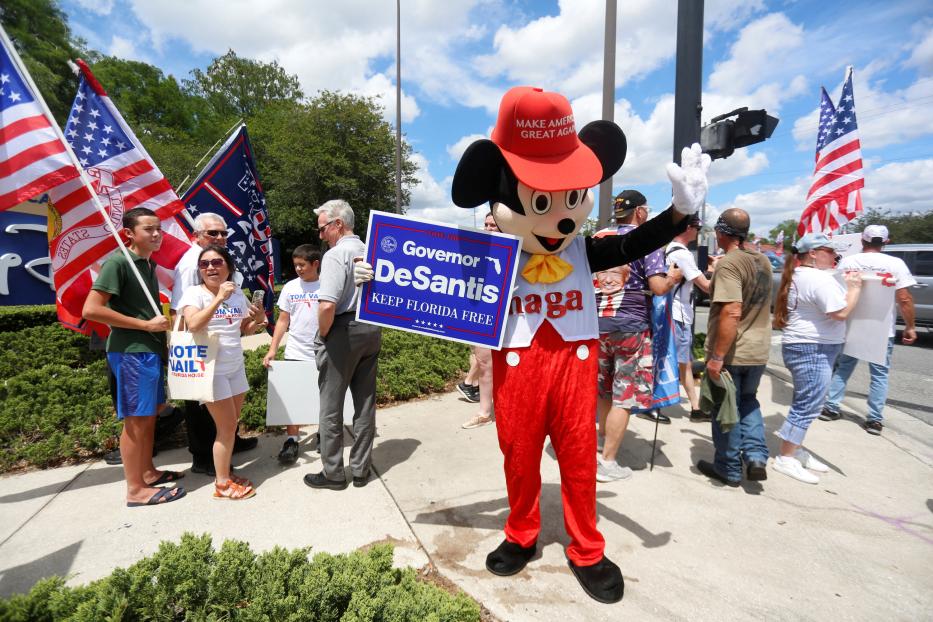 Supporters of Florida's Republican-backed "Don't Say Gay" bill gather outside Walt Disney World