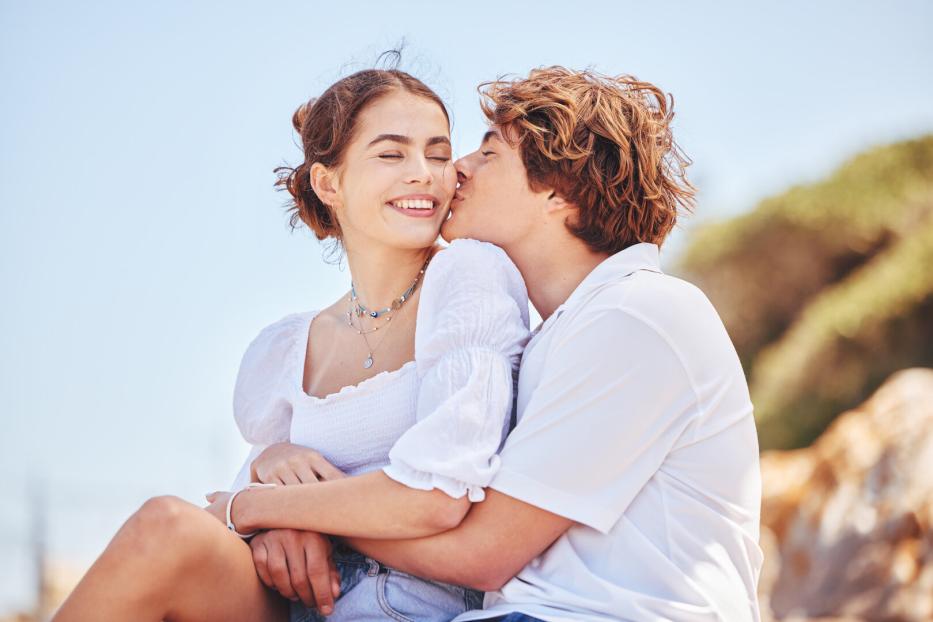 Shot of a young couple spending time together at the beach