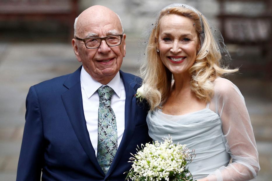 FILE PHOTO: Media Mogul Rupert Murdoch and former supermodel Jerry Hall pose for a photograph outside St Bride's church following a service to celebrate their wedding which took place on Friday, in London