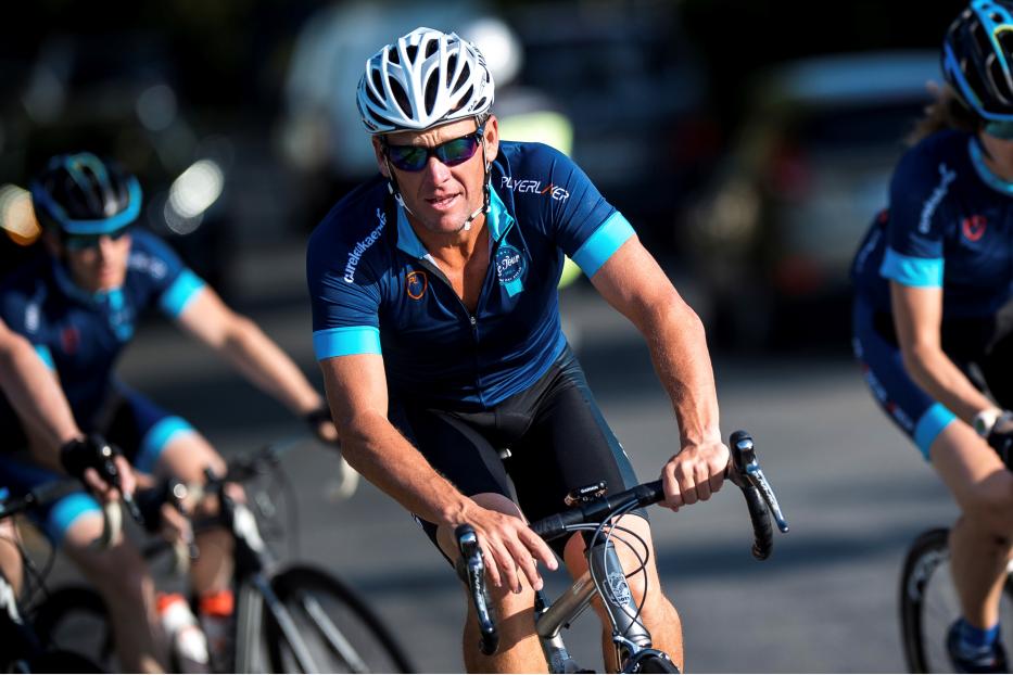 FILE PHOTO: Cyclist Lance Armstrong of the US cycles with a team of riders as he takes part in Geoff Thomas's 'One Day Ahead' charity event during a stage of the 102nd Tour de France cycling race from Muret to Rodez