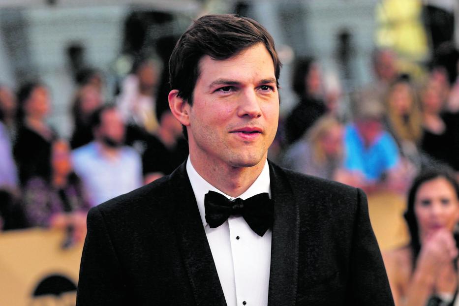 FILE PHOTO: Actor Ashton Kutcher arrives at the 23rd Screen Actors Guild Awards in Los Angeles