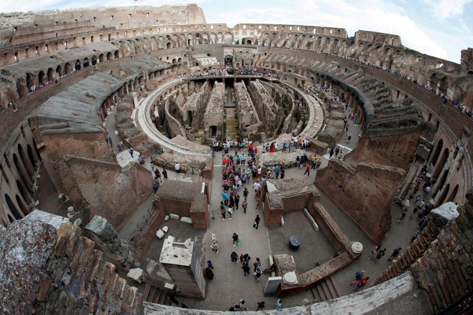 FILE PHOTO: Tourists visit the Colosseum in Rome