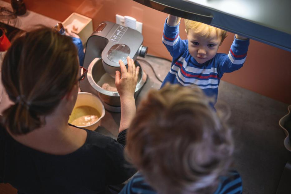 Mother and Sons Baking Cookies in the Morning