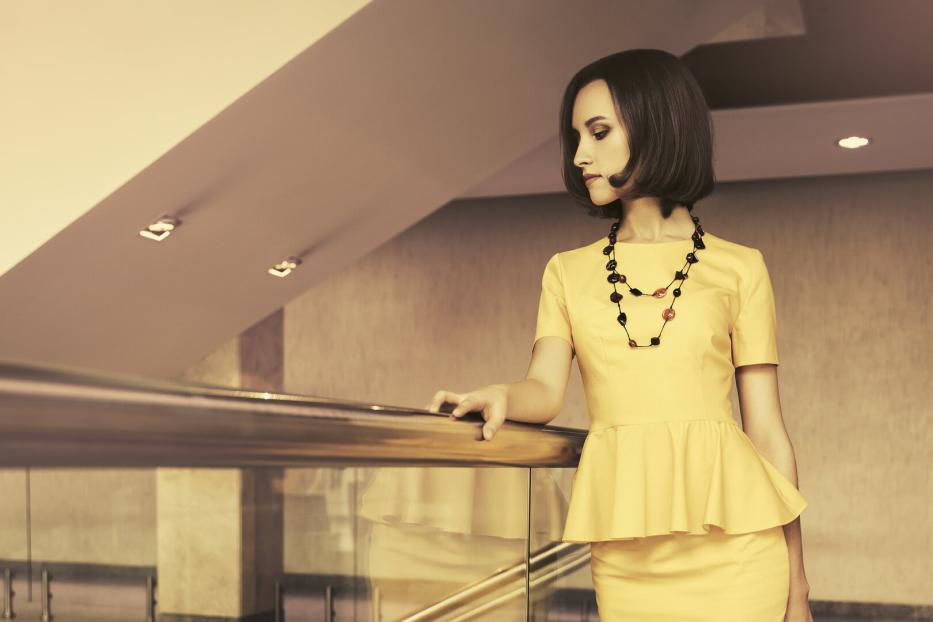 Young fashion business woman in office interior
