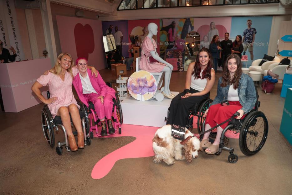 Sophie Morgan with a group of wheelchair users in front of the first wheelchair mannequin
