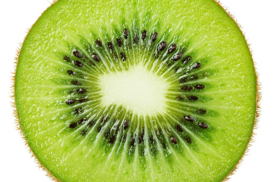 Slice of kiwi fruit isolated on white
