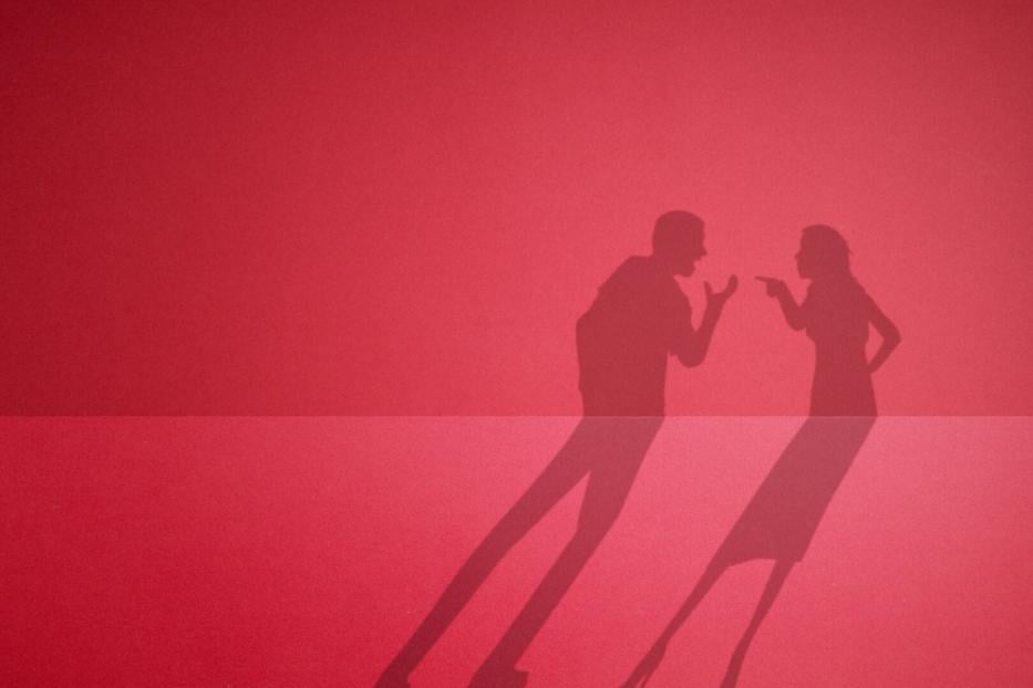 The shadow of a quarreling couple. fight between husband and wife.