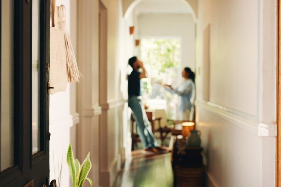Frustrated couple, fight or hallway with argument, conflict or disagreement for breakup in home. Angry, man and woman shouting with dispute for toxic relationship, cheating affair or divorce in house