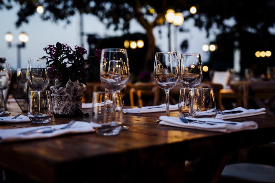 Luxury table settings for fine dining with and glassware, beautiful blurred  background. For events, weddings.