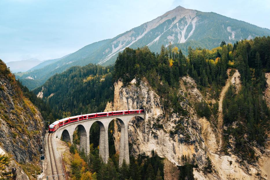 Scenic Train Journey Through Mountains in Switzerland