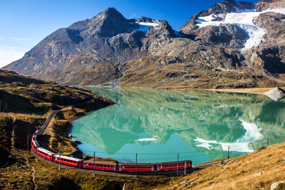 swiss train in the alps mountains in switzerland around ospizio bernina