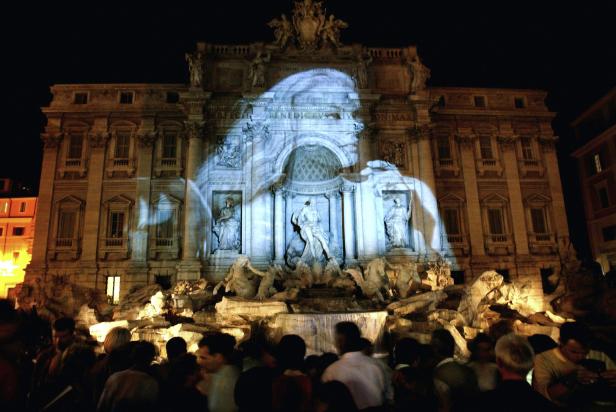 An image of Swedish actress Ekberg, protagonist of Federico Fellini's movie "La Dolce Vita", is projected onto the Trevi Fountain in Rome