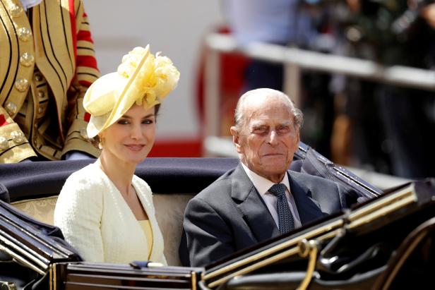 FILE PHOTO: Britain's Prince Philip rides in a carriage with Spain's Queen Letizia, following a ceremonial welcome on Horseguards Parade, in central London