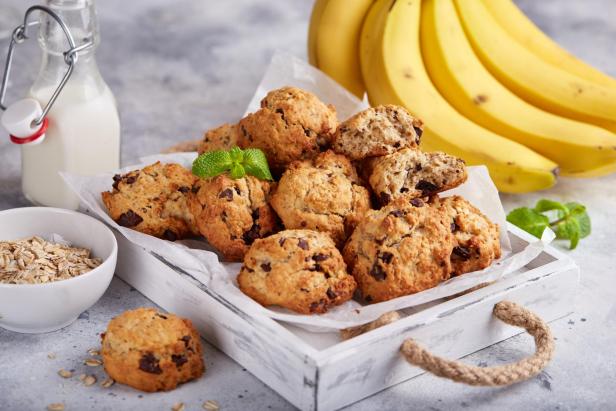 Cookies with oat flakes, bananas and chocolate. Delicious homemade biscuits served with milk.