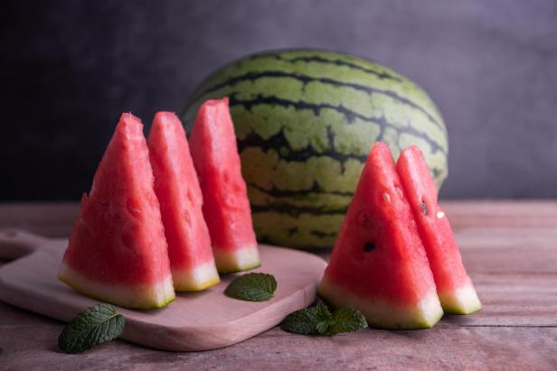 Slices of watermelons on cutting board - Stock-Fotografie