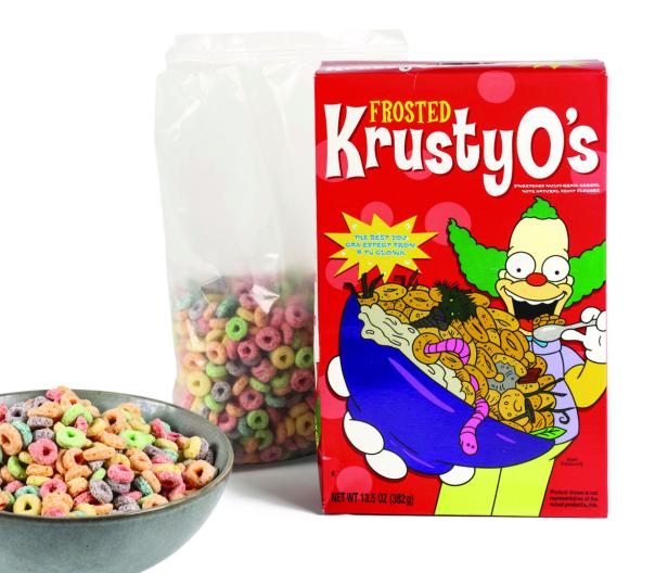 Eine rote Kartonpackung mit den KrustyO´s, das sind bunte Frühstücksringerl, für die Krusty, der Clown Werbung macht