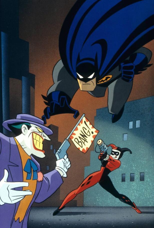 Ein Ausschnitt aus einem Zeichentrickfilm der "Animated Serie": Joker hält Batman eine Pistole entgegen, aus der eine Fahne mit "Bang!"-Schriftzug schießt. Harley Quinn mit Harlekinkostüm zielt auch auf den Superhelden.