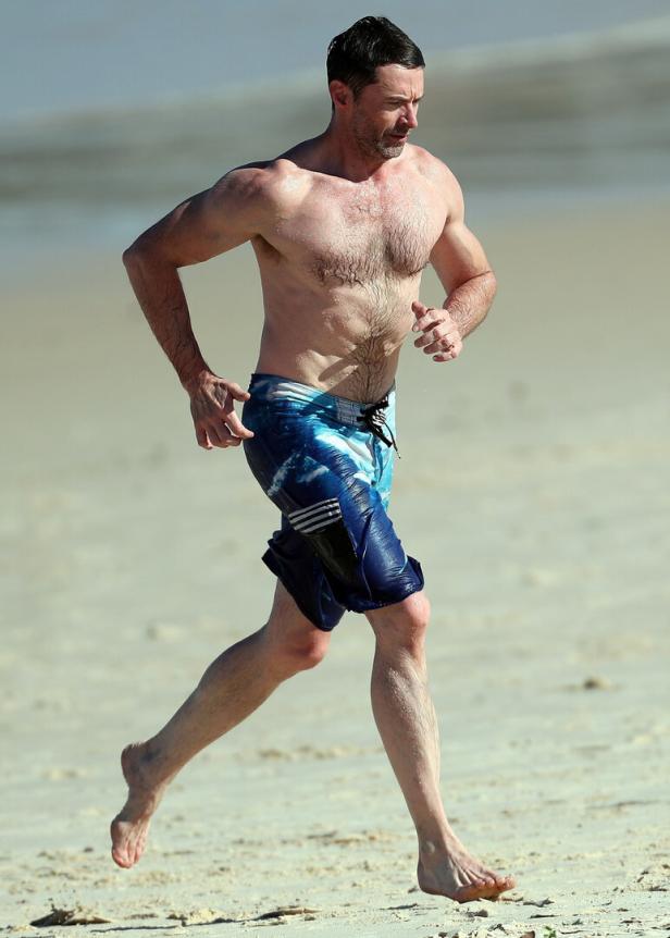 Hugh Jackman's buff bod grabs the attention of beach-goers while on the beach in Sydney! Hugh Jackman's buff bod grabs the attention of beach-goers while on the beach in Sydney!