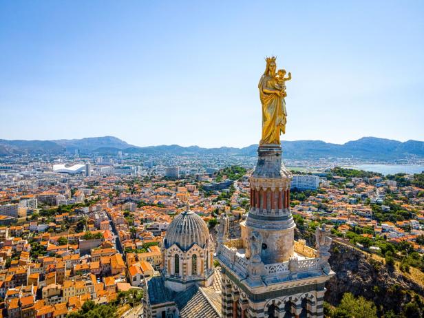 The aerial view of Basilique Notre-Dame-de-la-Garde in Marseille, a port city in France The aerial view of Basilique Notre-Dame-de-la-Garde in Marseille, a port city in France