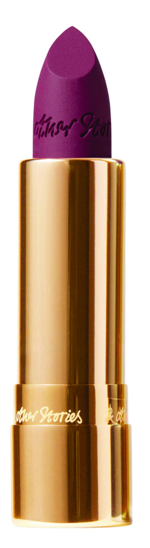 Ein burgunderfarbener Lippenstift von & Other Stories in einer goldenen Hülse.