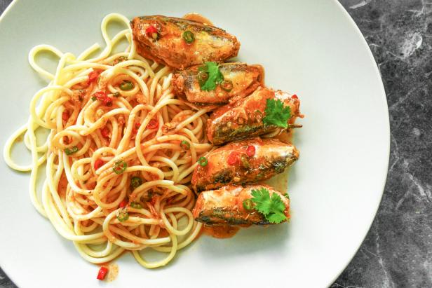 Pasta sardines. Spaghetti with canned sardine with tomato sauce.