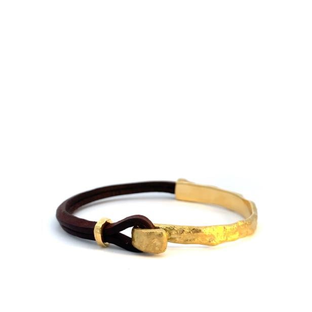 ein Armband in Schwarz-Gold