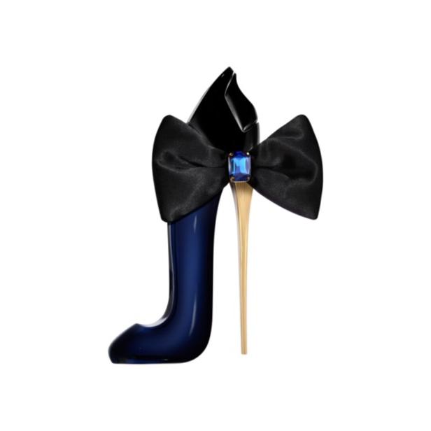 Ein dunkelblauer High Heel mit goldfarbenem Absatz und großer schwarzer Schleife mit blauem Schmuckstein.