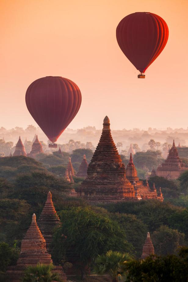 Balloon over plain of Bagan in misty morning, Myanmar