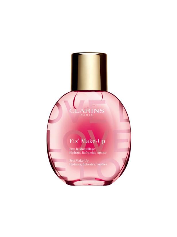Eine Flasche Clarins Fix' Make-Up mit goldenem Verschluss steht vor einem weißen Hintergrund.
