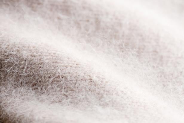 pink knitted angora and wool background.