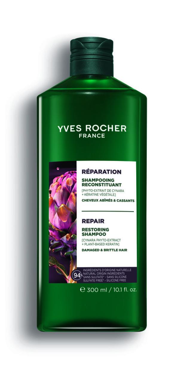 Grüne Flasche Yves Rocher Shampoo für strapaziertes Haar mit lila Blume und weißem Etikett.