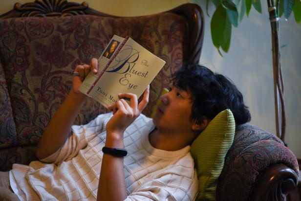 A student reads ahead of a banned book club meeting in Sugar Land
