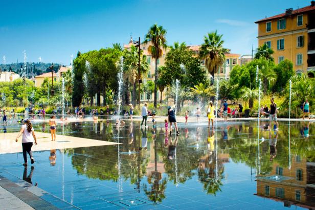 People among fountains at Promenade du Paillon, Nice , France