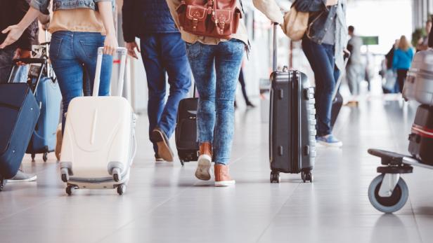 Passengers walking in the airport terminal