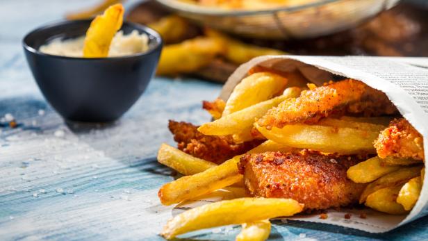 Closeup of Fish & Chips served in the newspaper