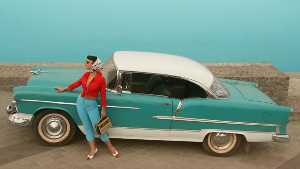 Beautiful Pin-Up Girl  Near The Vintage Car