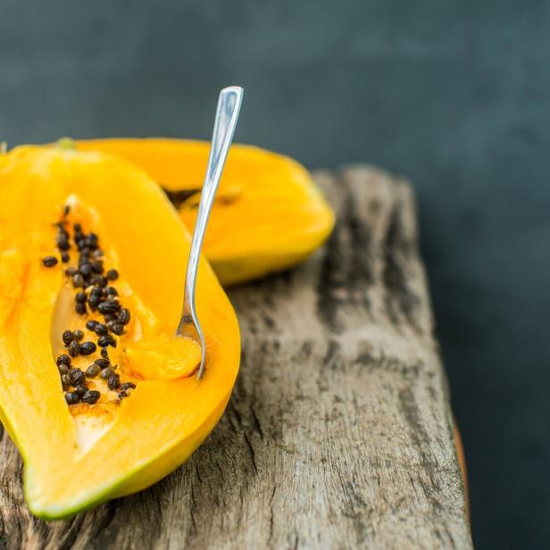 Papaya on wooden board Papaya on wooden board