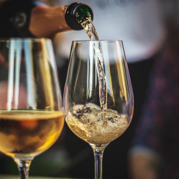 pouring rose champaign into a glass