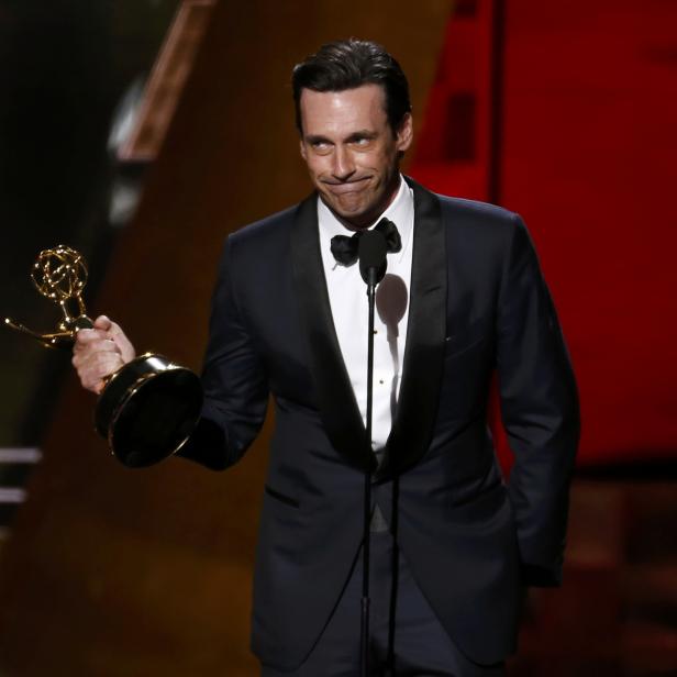 Jon Hamm accepts the award for Outstanding Lead Actor In A Drama Series for AMC's "Mad Men" at the 67th Primetime Emmy Awards in Los Angeles