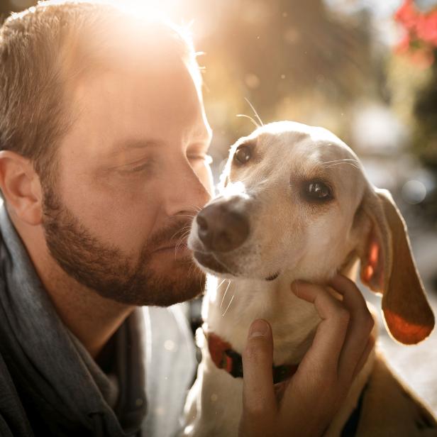 Man with his dog natural light portrait