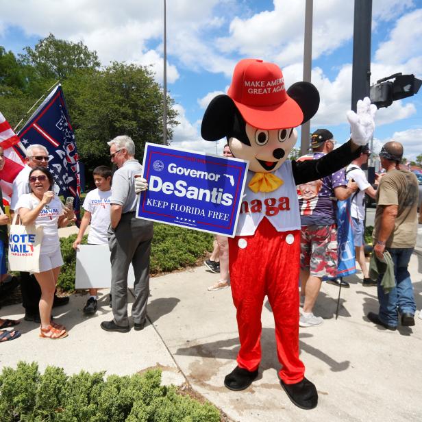 Supporters of Florida's Republican-backed "Don't Say Gay" bill gather outside Walt Disney World