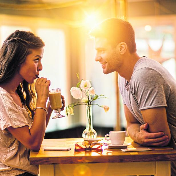 Young couple in love spending time together in a cafe.