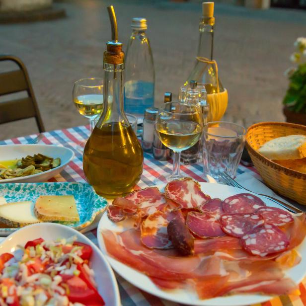 White wine and tasty italian homemade snack.