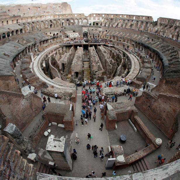 FILE PHOTO: Tourists visit the Colosseum in Rome