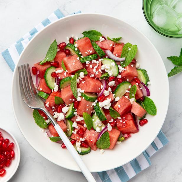 Watermelon, cucumber, feta and mint salad in white bowl